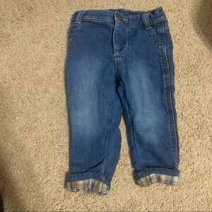 Carter’s size 12 months jeans with plaid design on cuffs